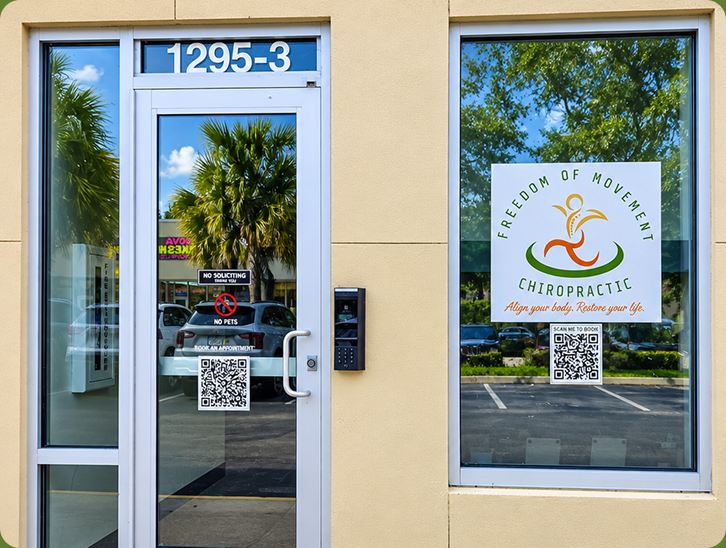 Entrance to suite 1295-3 with the Freedom of Movement Chiropractic logo on the window